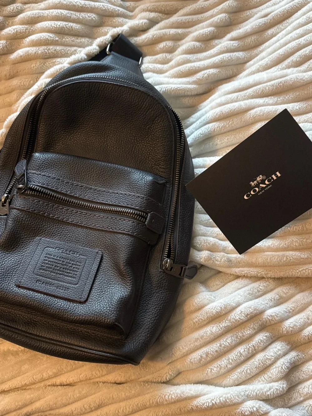 Coach Men’s Black Leather Sling Backpack
